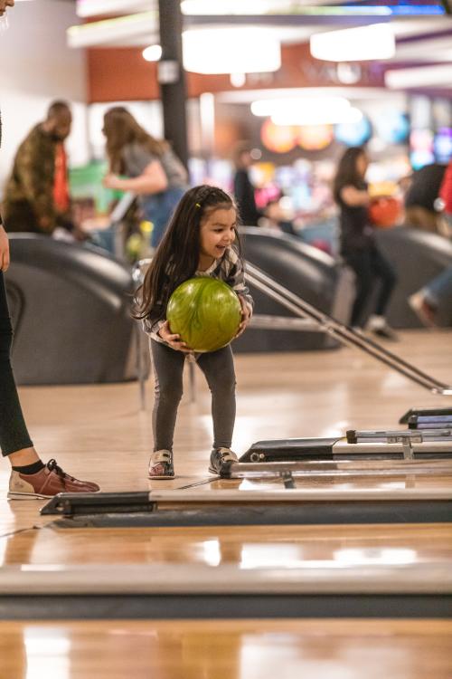 child bowling at Revel and Roll