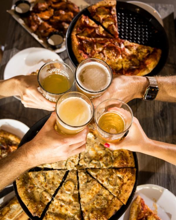 Parlour Jeffersonville Beer Cheers around pizza