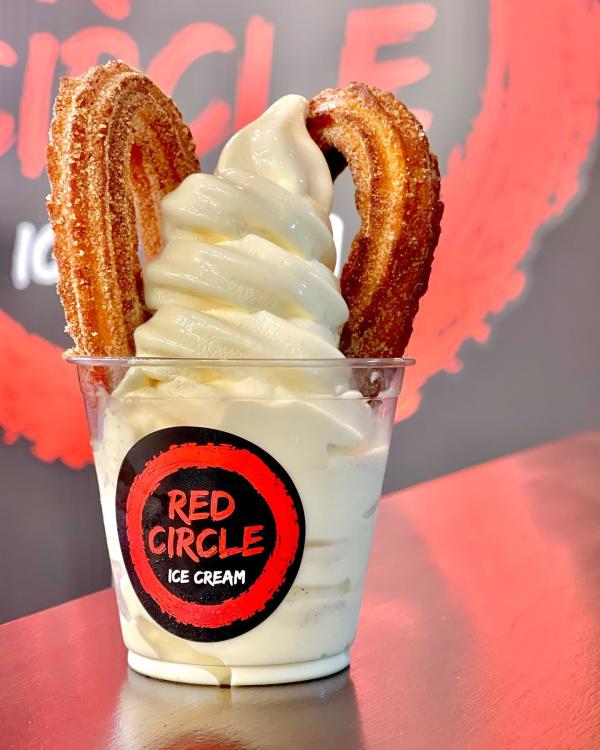 plastic cup with soft serve ice-cream and churro at Red  Circle Ice-Cream
