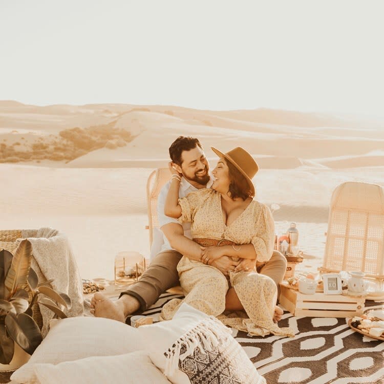 couple enjoying luxury picnic on beach