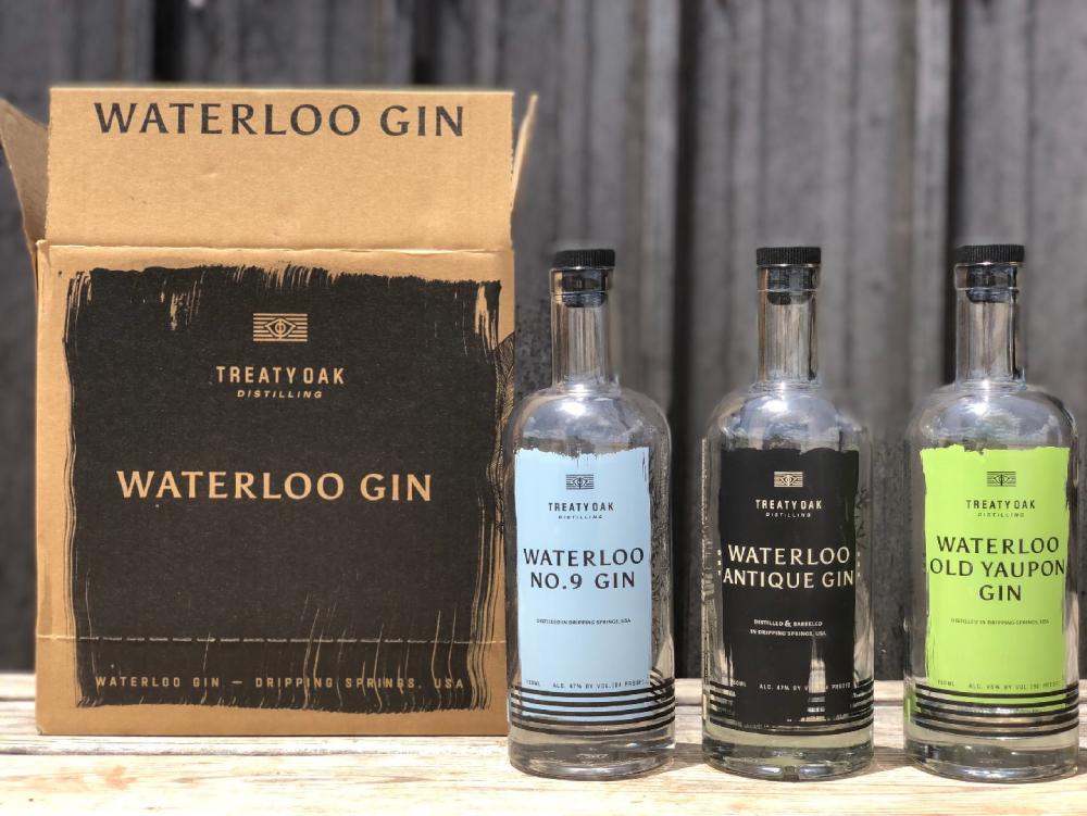 Bottles of Waterloo Gin with shipping box from Treaty Oak Distilling near austin texas