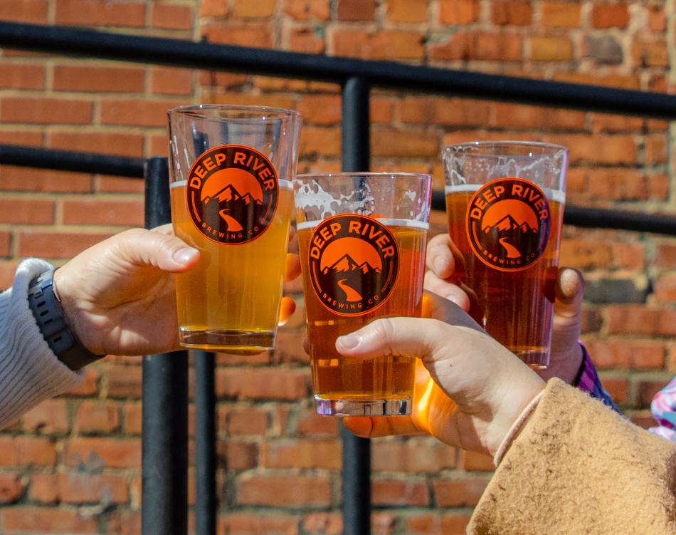 Cheers of beer at Deep River Brewing in Clayton, NC.