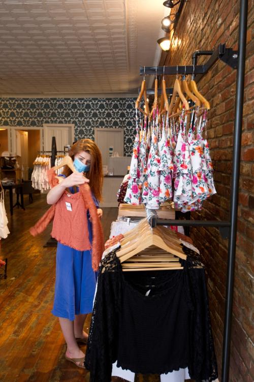 Woman in mask shopping at DADA in Southern Indiana