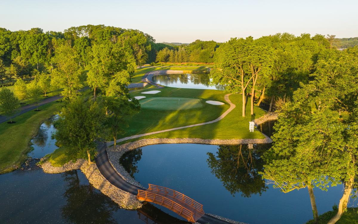 A golf green surrounded by three sand traps and water hazards at The Club at Twin Lakes in Allentown, Pa.