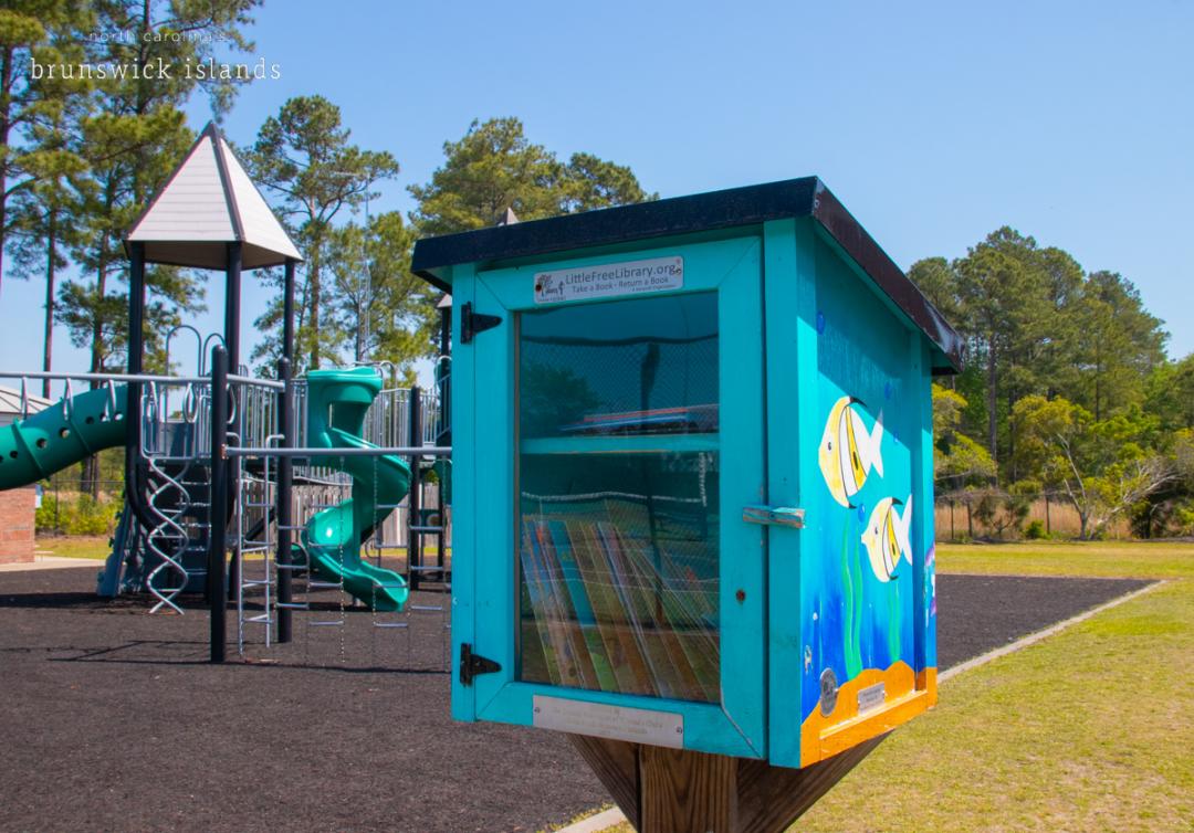 blue box with books in a playground