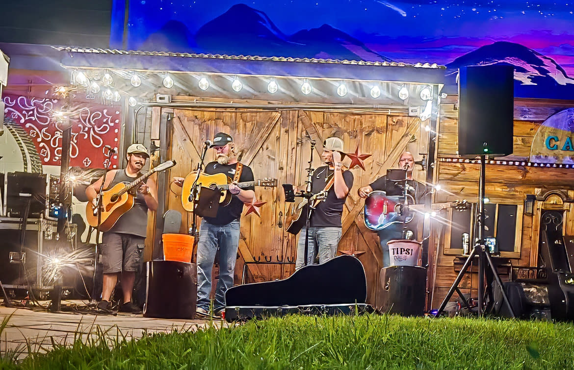 A band plays outside of the Cowboy inn Saloon