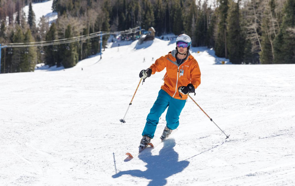 Skier on the beginner's hill at Pajarito Mountain Ski Area