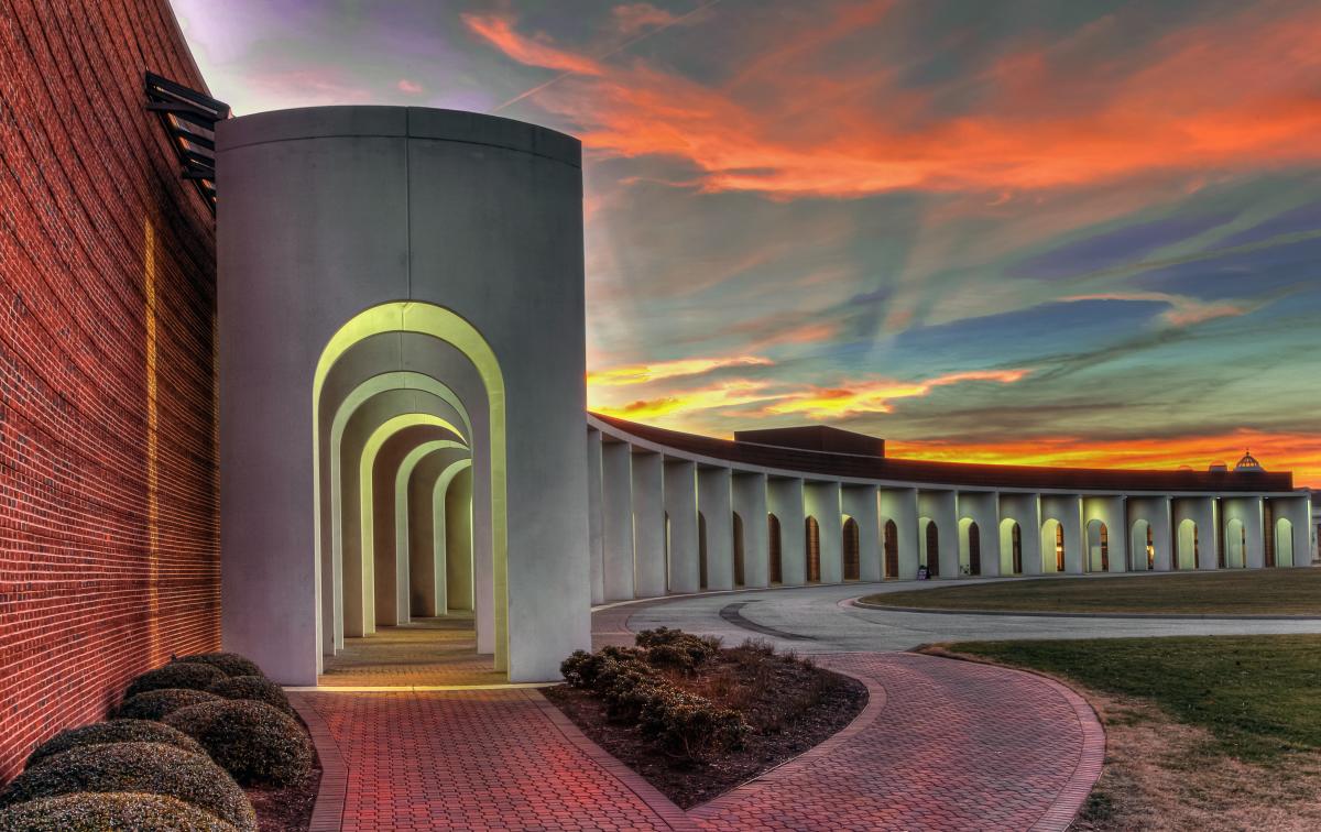 The Ferguson Center for the Arts columns with a sunset
