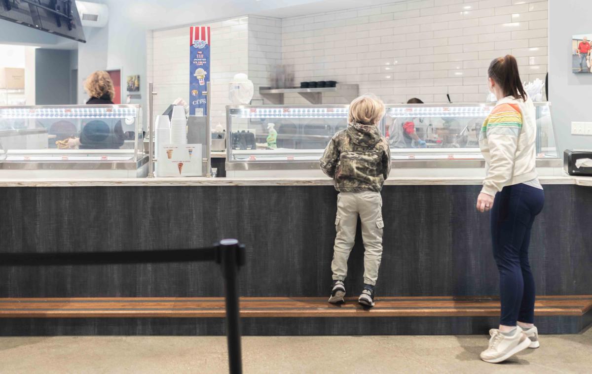 Woman and boy at ice cream counter