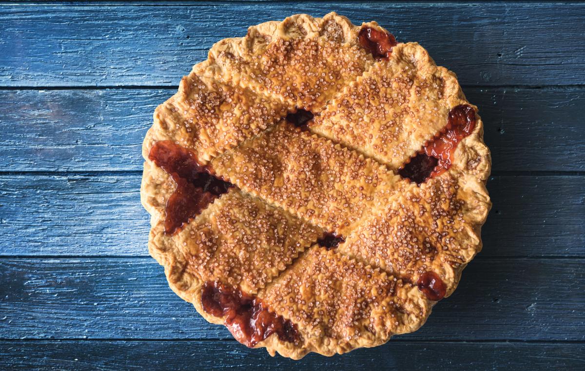 cherry pie on blue wood table