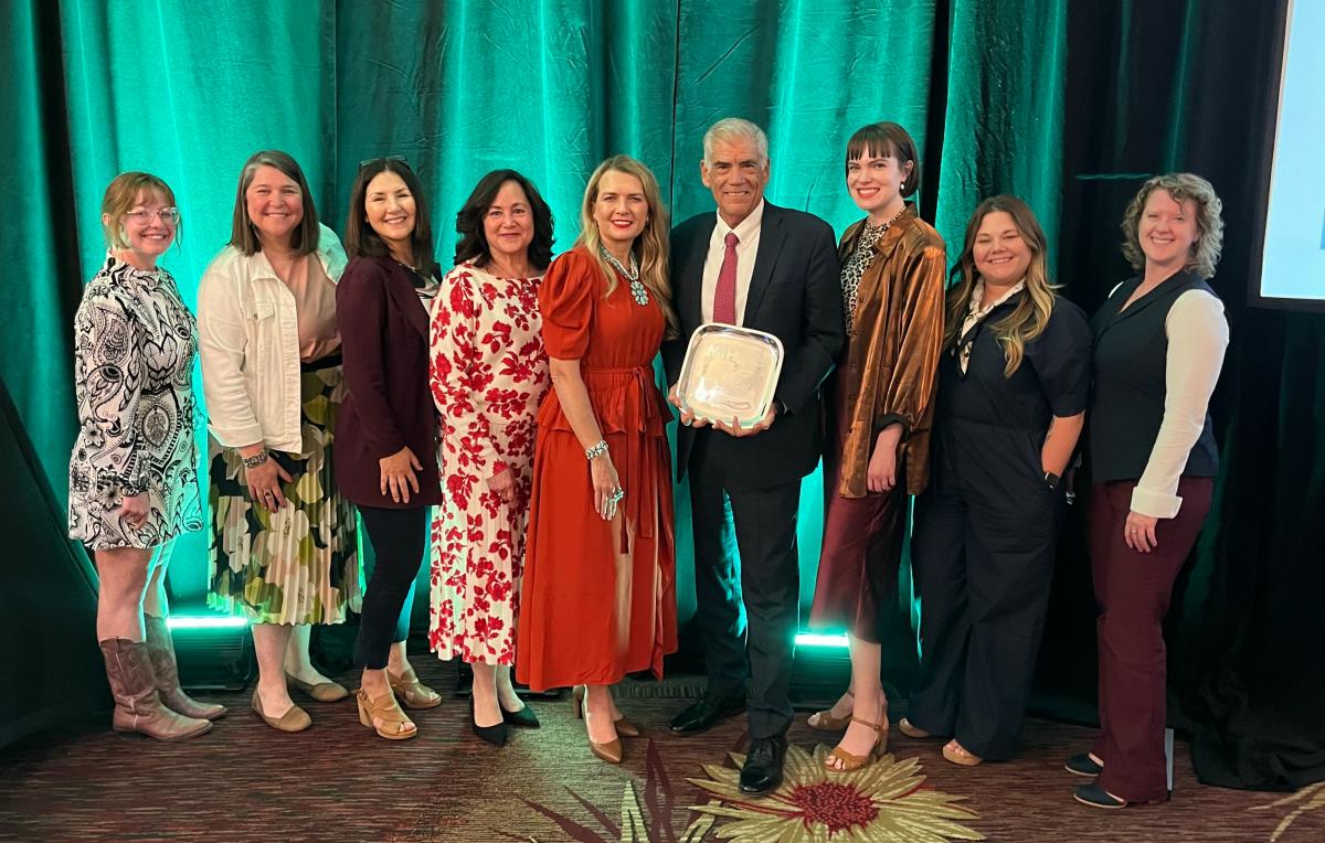 Mike Canfield with the Visit Albuquerque staff at the 2025 Hall of Fame dinner.