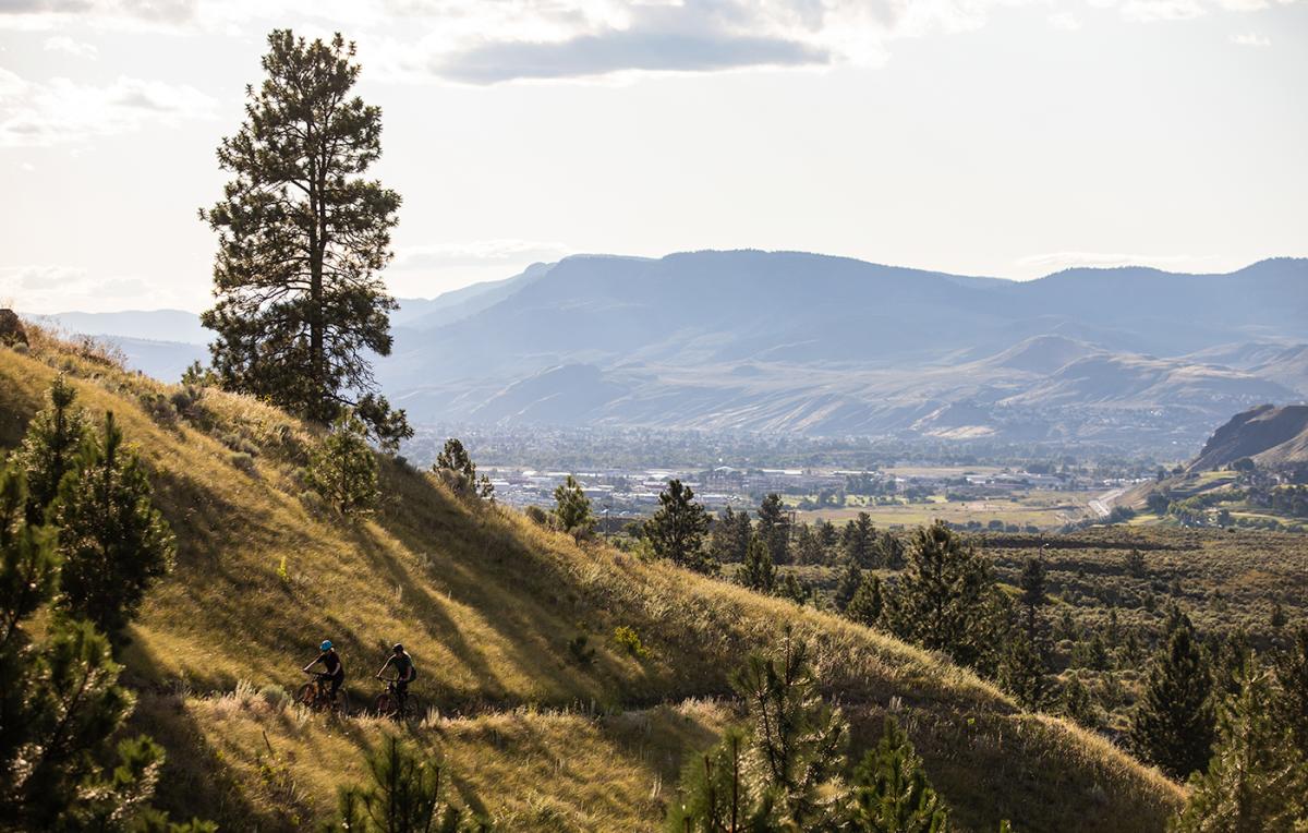 Two people mountain biking in the Kamloops Bike Ranch