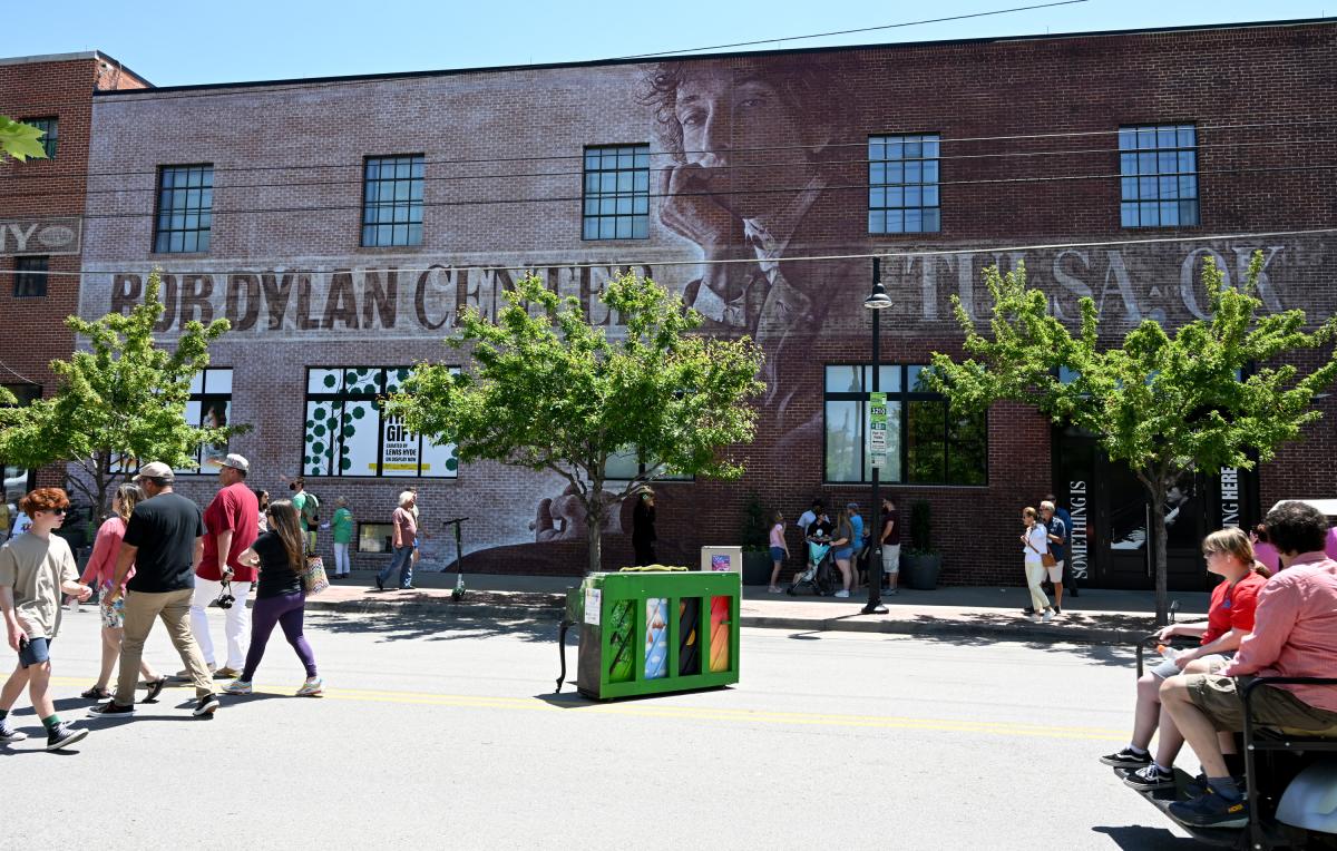 Bob Dylan Center exterior with people walking in front of it