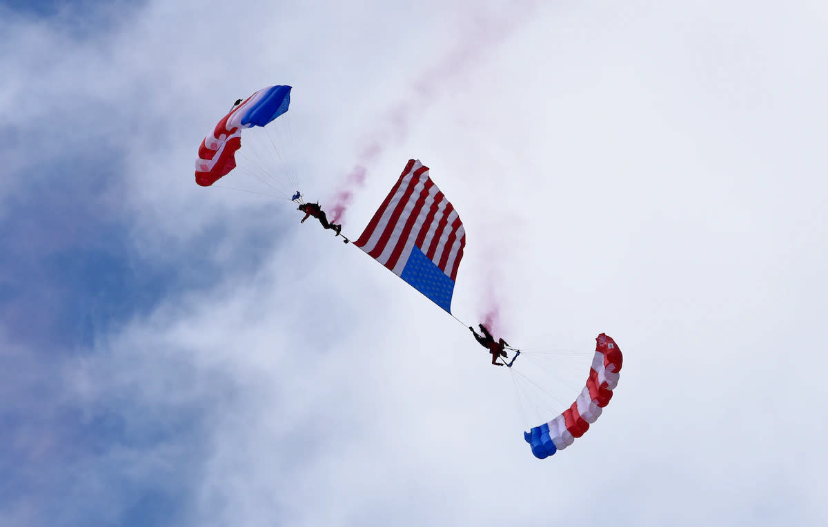 Members of the Patriot Parachute Team perform in the skies during the Frontiers in Flight Air Show and Open House at McConnell Air Force Base