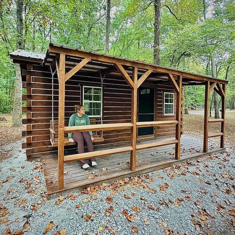 Ellen checks out the porch swing at Hawthorn Park’s newest cabin – which will be available for campers in 2025.