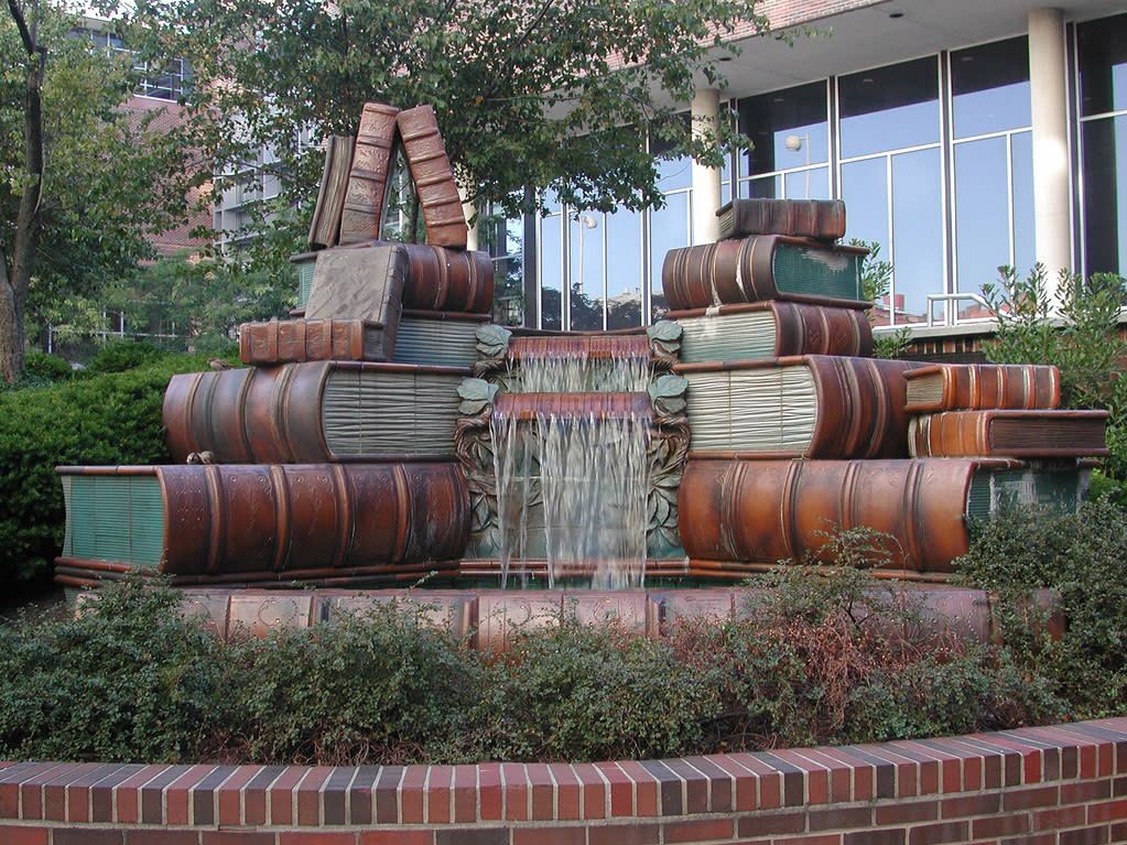 The image is of a water fountain made to look like old timey, thick books.