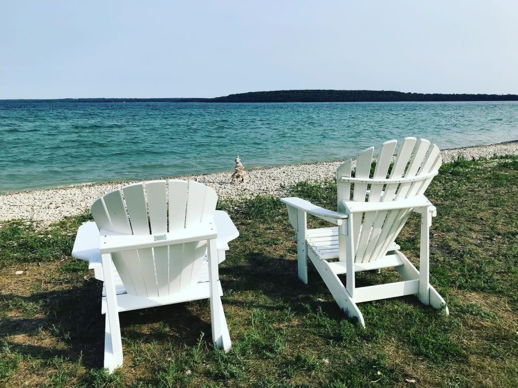 Empty Pair of Adirondack Chairs on Beach on Mackinac Island
