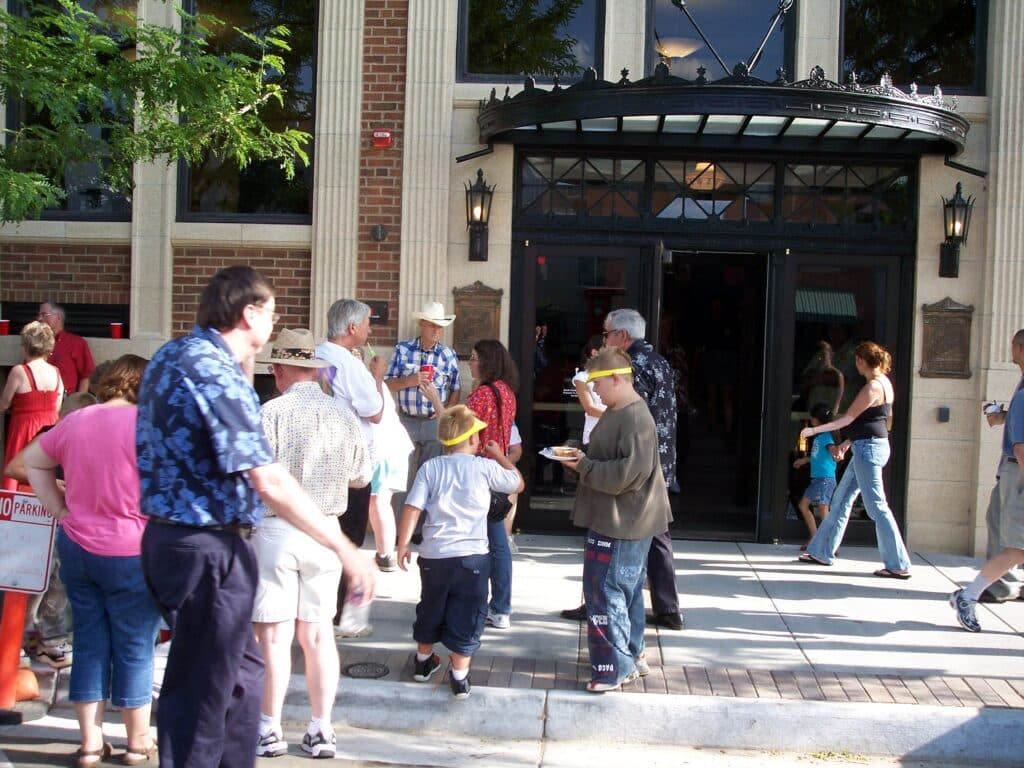 Greeley residents enter the Greeley History Museum on a sunny day