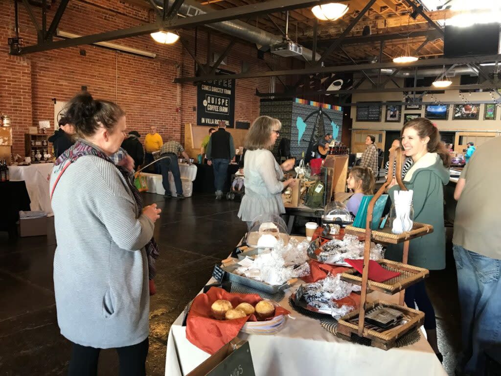 Holiday revelers purchasing baked goods.