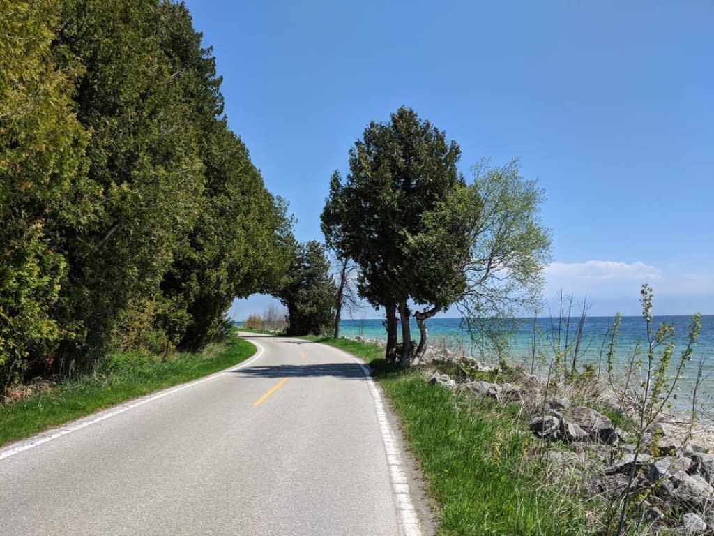 Car-free M-185 follows the lakeshore all the way around Mackinac Island