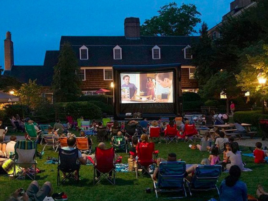 Movie night in a park with lawn chairs
