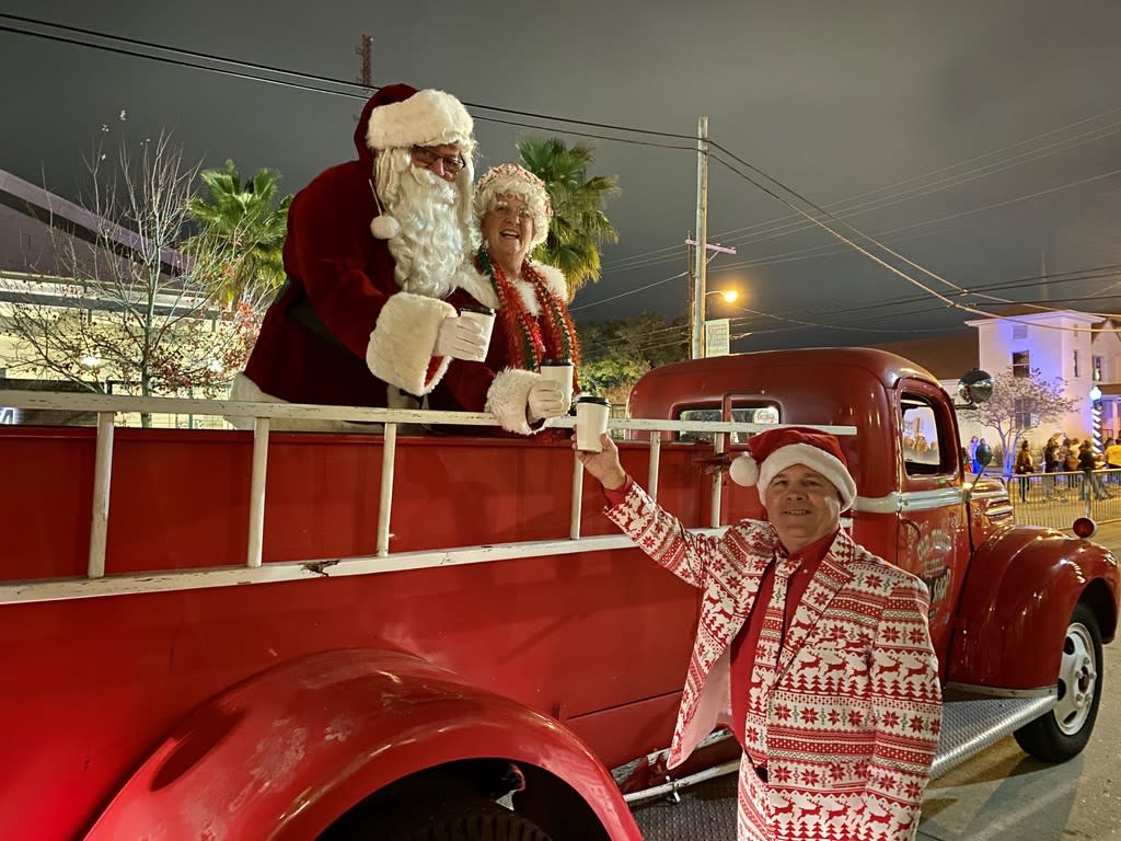 Mayor Greg Cromer along with Santa and Mrs. Claus toast the season for the Olde Towne Slidell Community Christmas Parade.