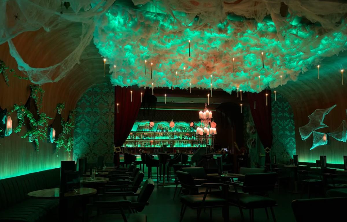 The interior of Barnato showcasing spooky lights during a Halloween event.