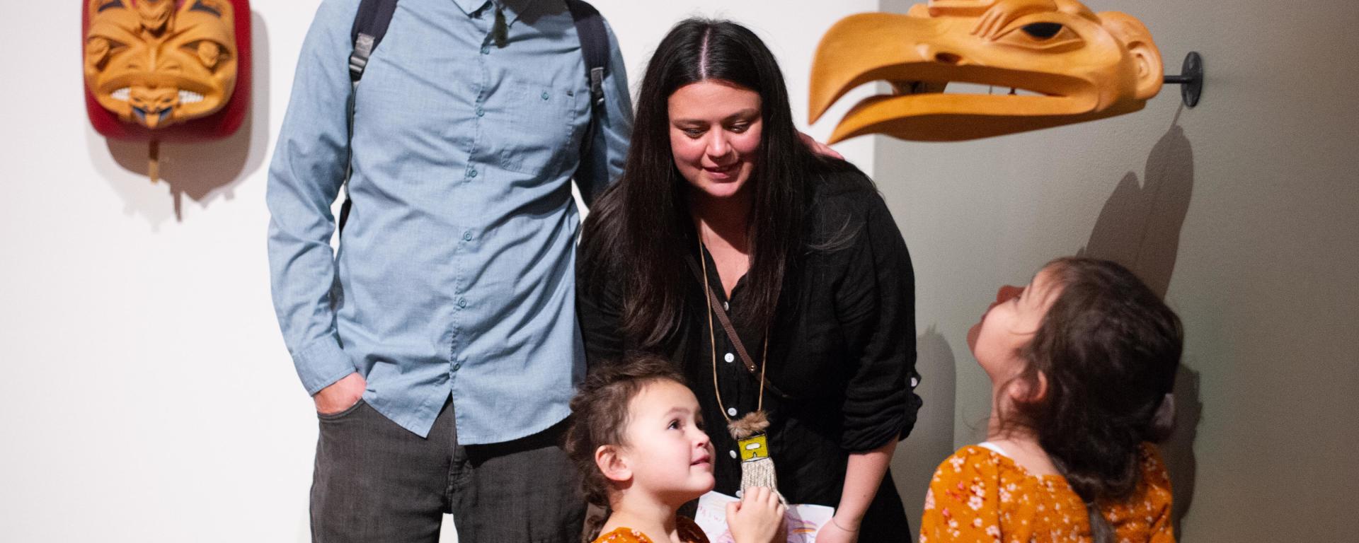 A family explores an exhibition together
