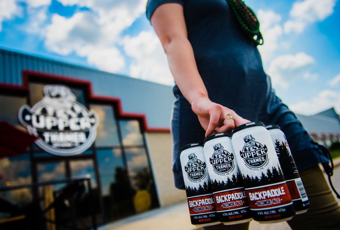 Upper Thames Craft Beer Woman Carrying Cans