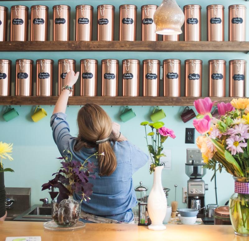 Two baristas searching for tea at Cup & Kettle