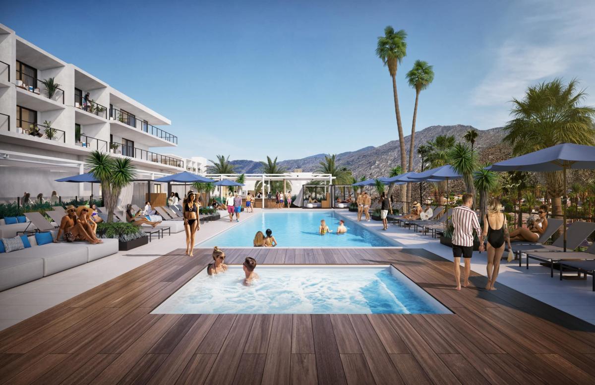 A vibrant resort pool area with guests lounging and swimming, surrounded by palm trees and modern architecture, set against a backdrop of mountains under a clear sky.