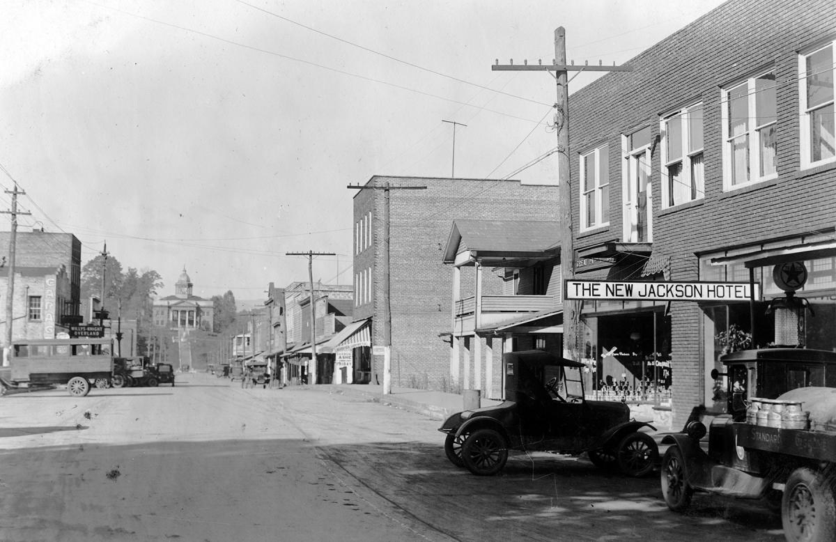 1920s view up Main Street in Sylva, NC, past the New Jackson Hotel, Model T cars and a Standard Gasoline truck toward the courthouse on the hill