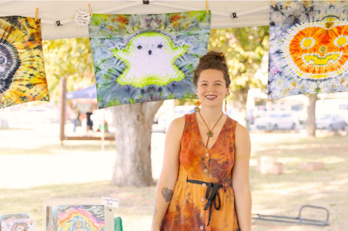 A woman sells tiedyed Halloween goodies at Art Scared in Downtown San Marcos, Texas