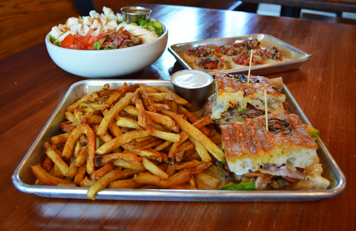 Plates of Food on a Tabletop at Bread & Bottle in Downtown Princeton.