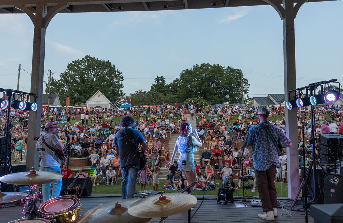 A band plays on stage at the Smithfield Amphitheatre.