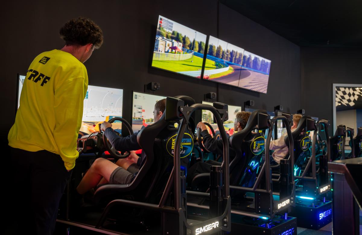 People playing a driving game at ADK Karting
