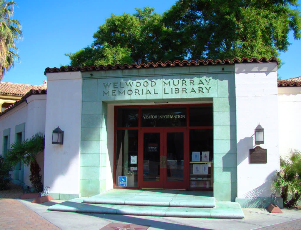 Front view of the Welwood Murray Memorial Library with its main entrance and sign visible.