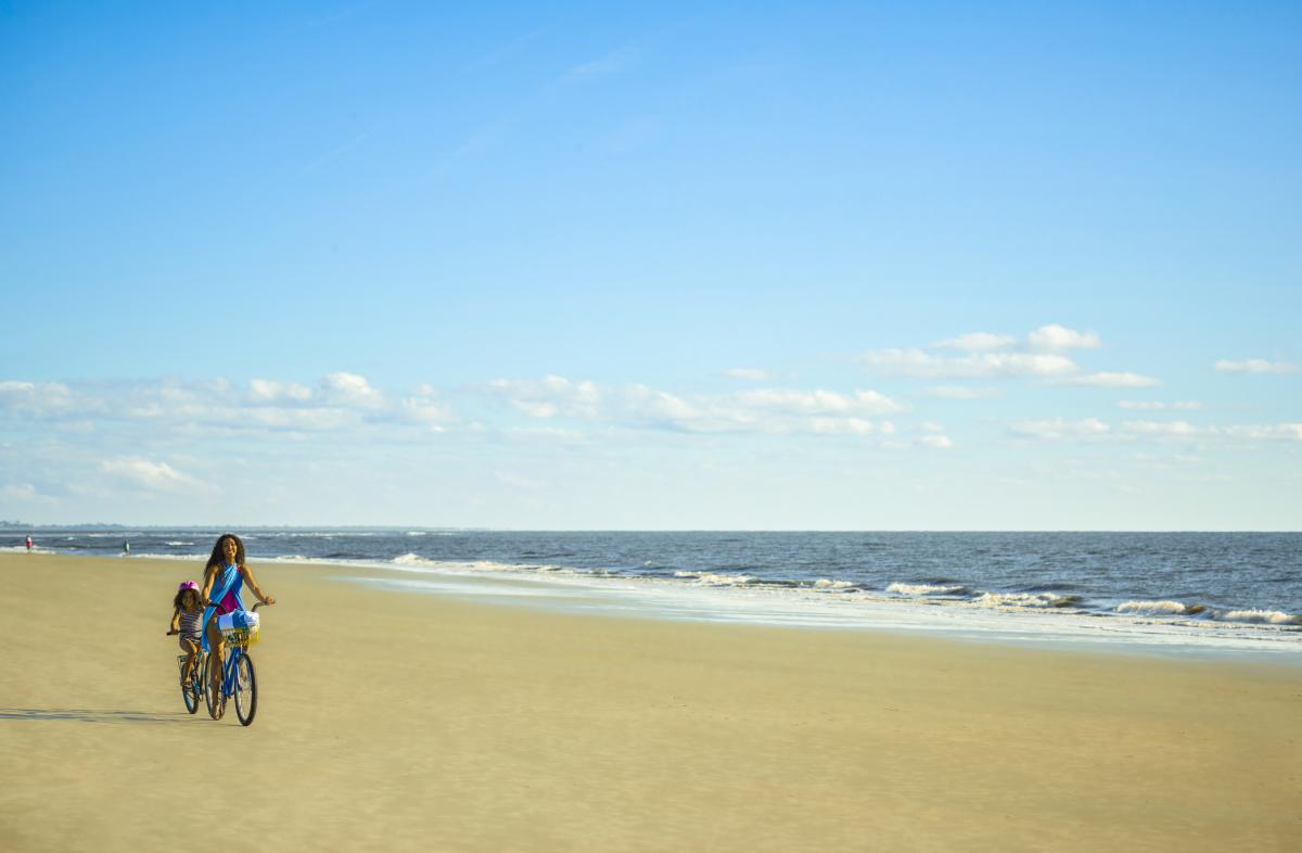 Family biking on East Beach