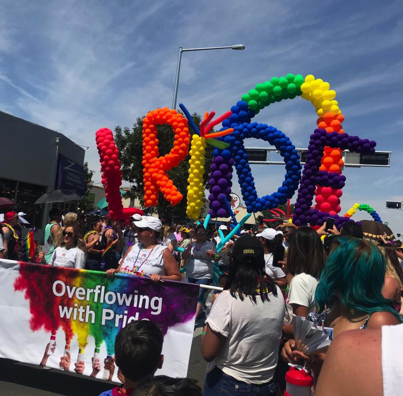 A group of people walk down Central during the Albuquerque Pride Parade.