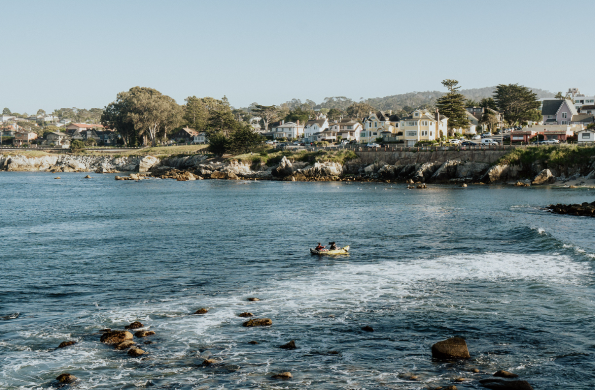 two people kayaking in the water