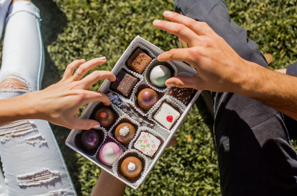 Couple share chocolates