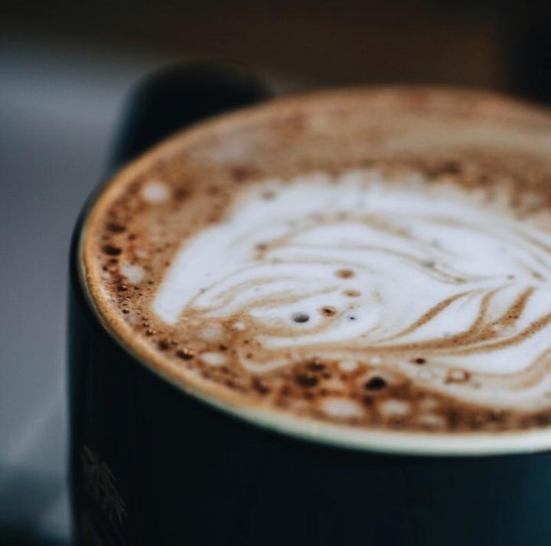 A close up of a latte at Bad Ass Coffee