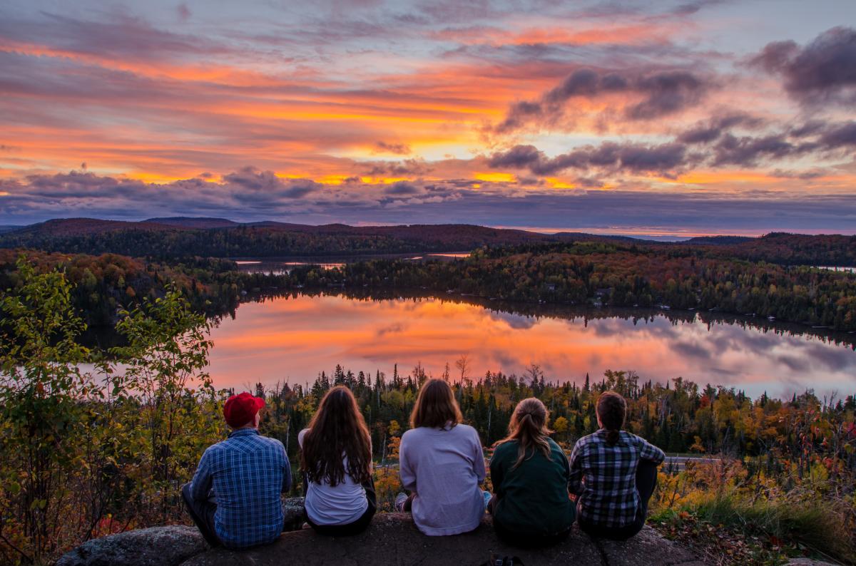 Group on top of White Sky Rock overlooking fall colors