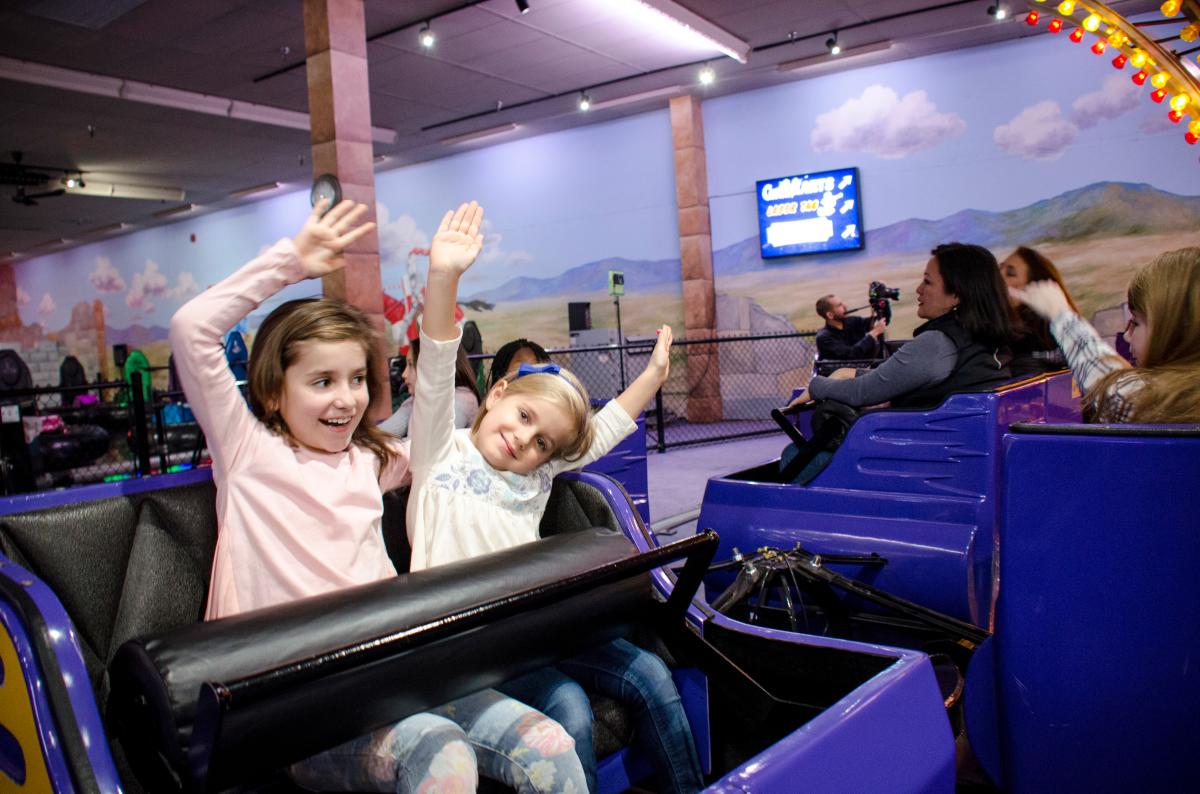 children on amusement park ride