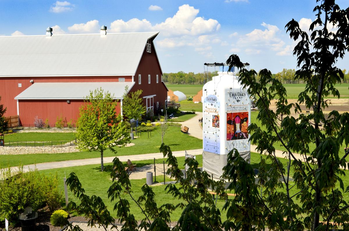 Aerial shot of the birthing barn and the giant milk jug climbing wall at Fair Oaks Farms in Newton County.