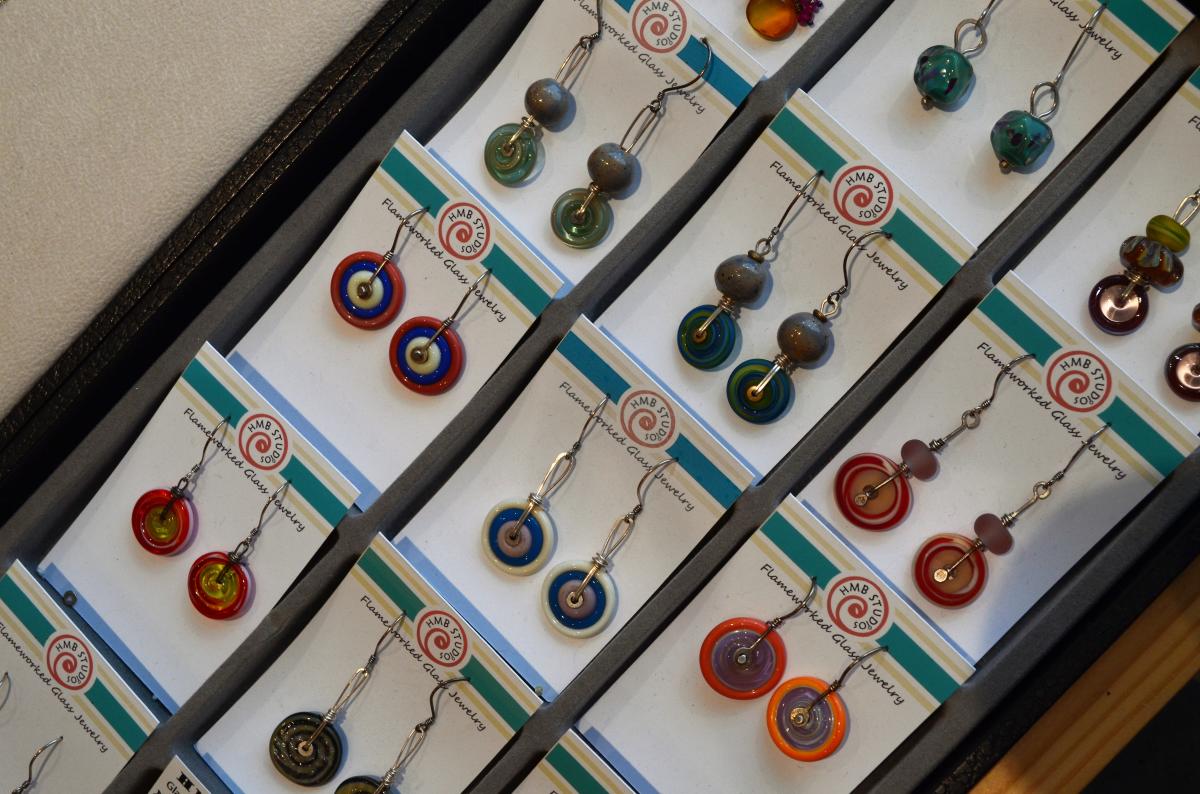 Heather displays her jewelry in the new Exhibit B Gallery