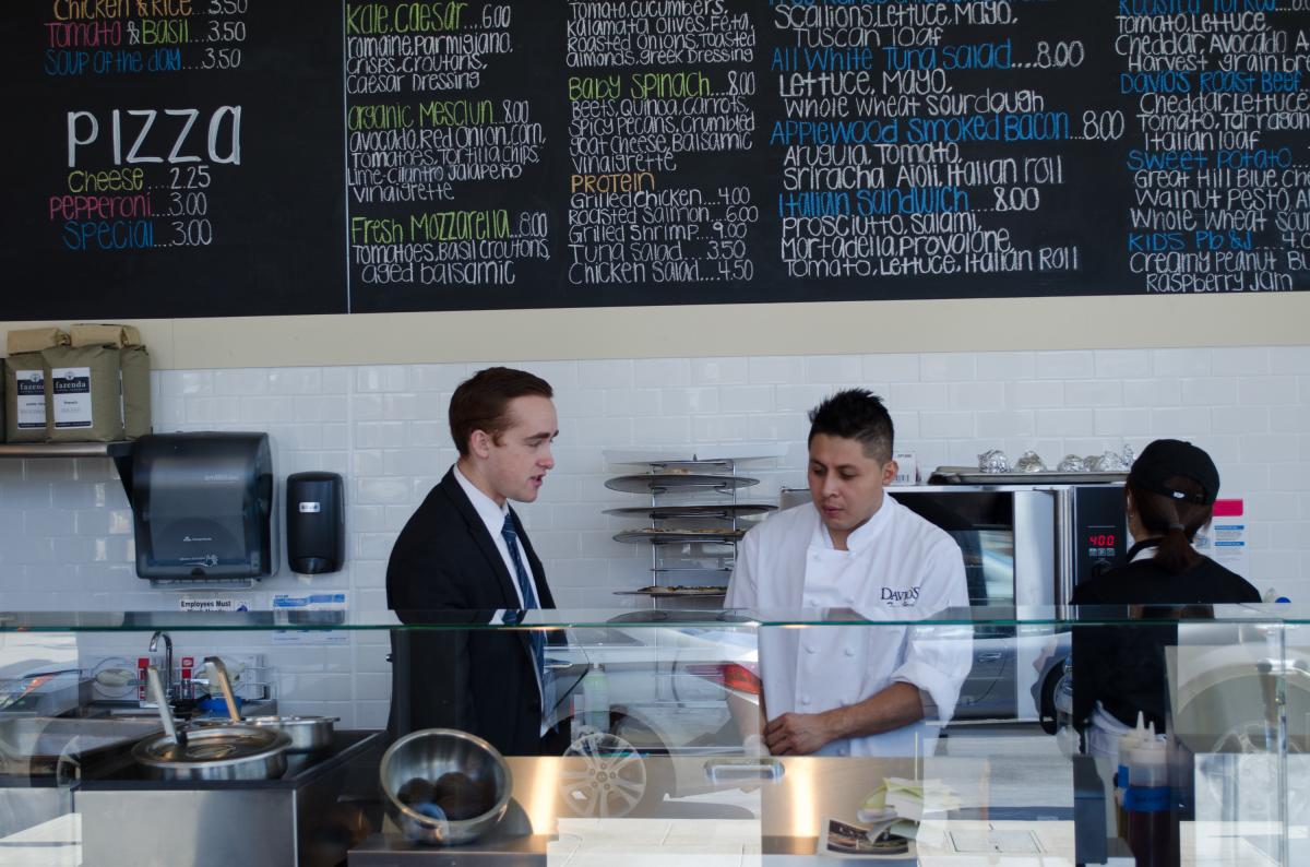 Michael DiFillippo instructs the staff during the Galleria's opening
