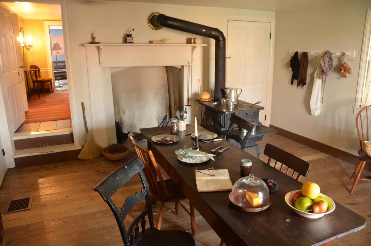 A kitchen with a fireplace
