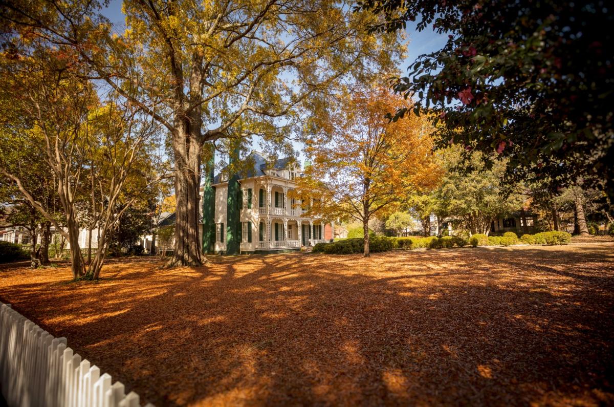 Historic home surrounded by fall foliage