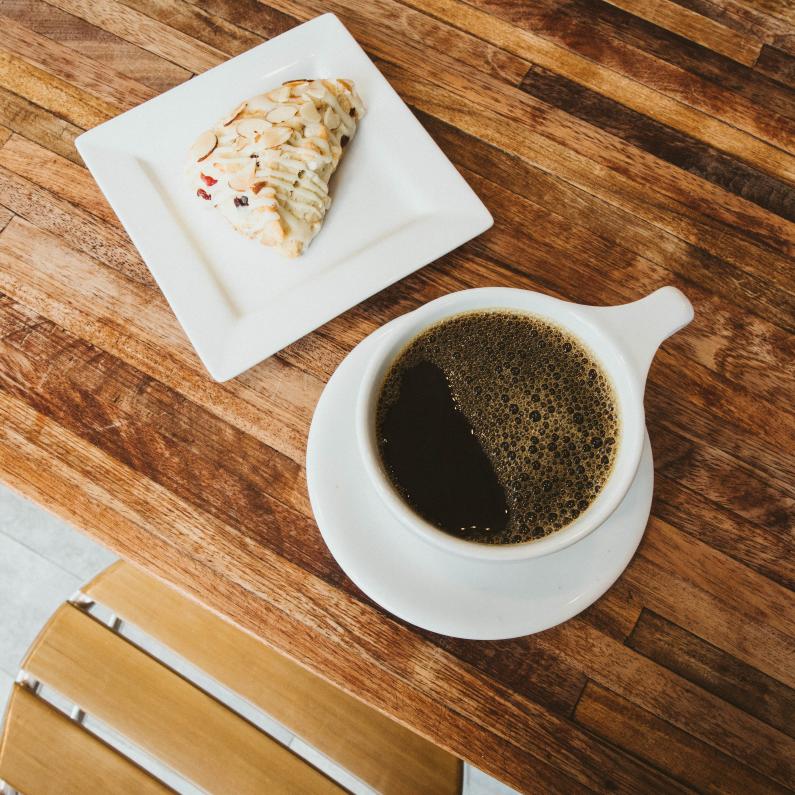 Cup of coffee and a pastry at Denim Coffee in PA